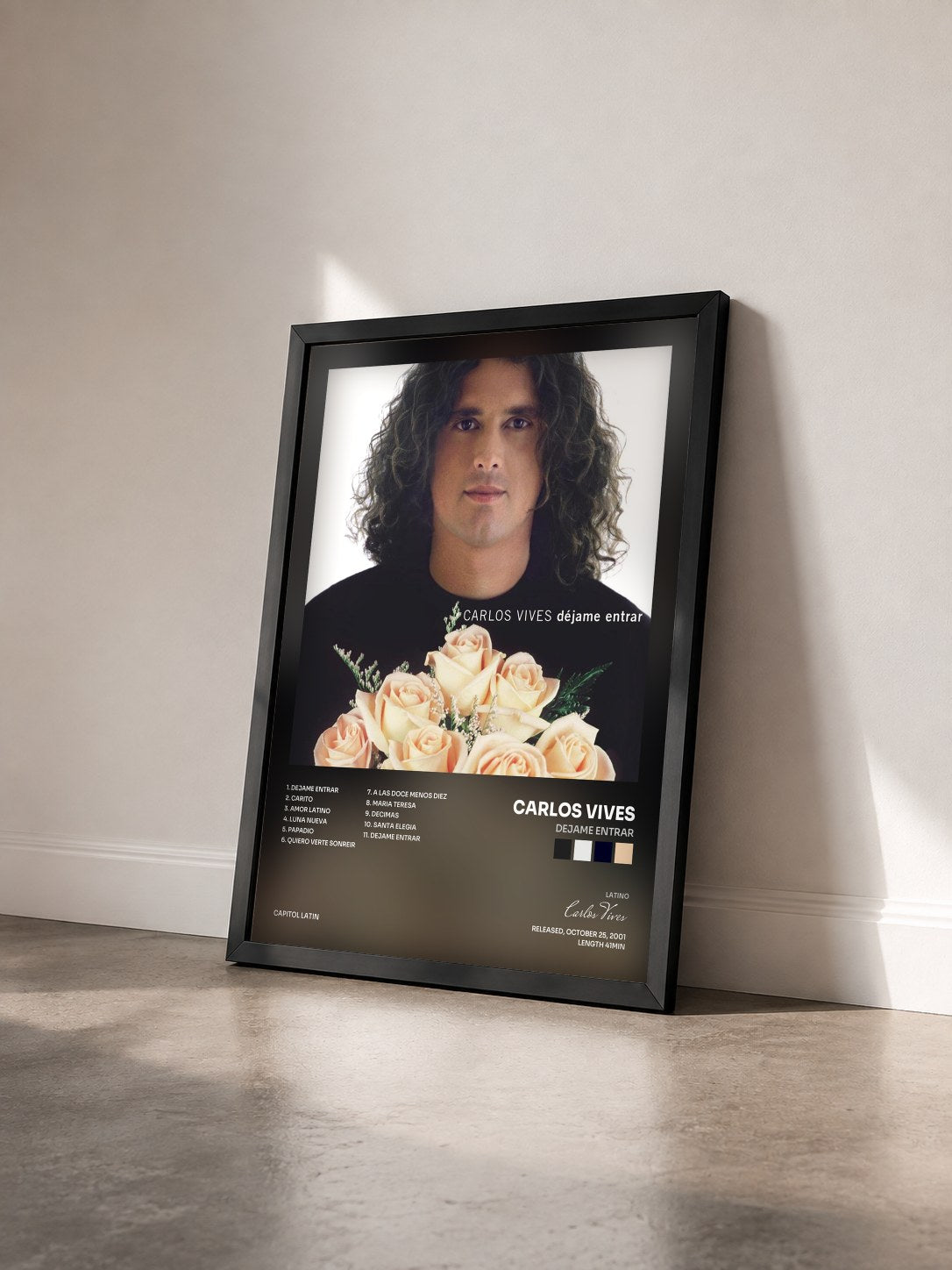 #noir Tableau de l'album Dejame Entrar de Carlos Vives vu de trois quarts, cadre noir
