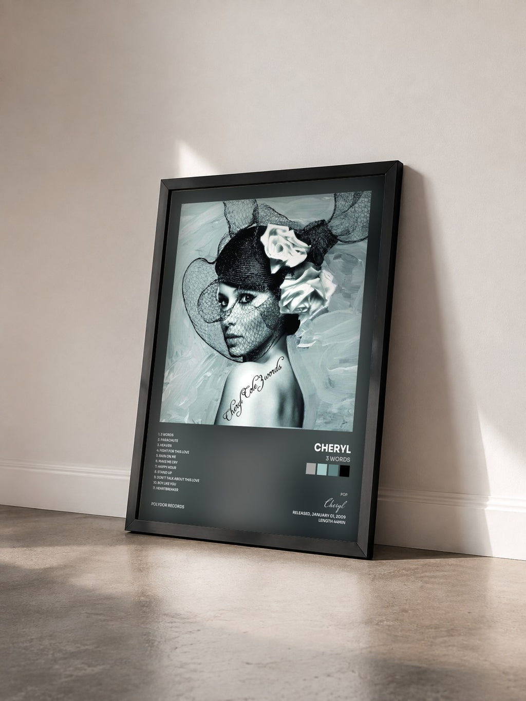 #noir Tableau de l'album 3 Words de Cheryl vu de trois quarts, cadre noir
