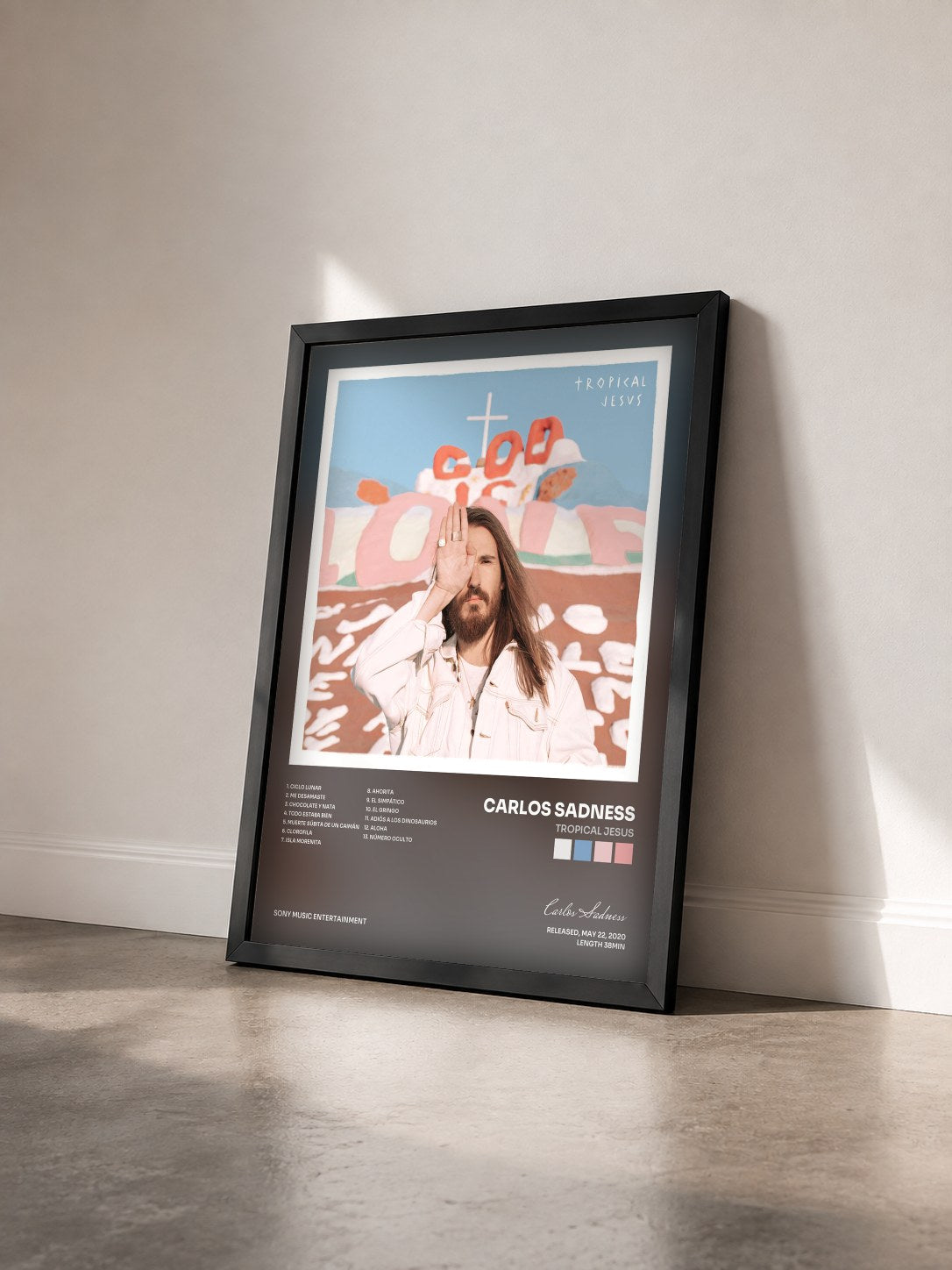 #noir Tableau de l'album Tropical Jesus de Carlos Sadness vu de trois quarts, cadre noir
