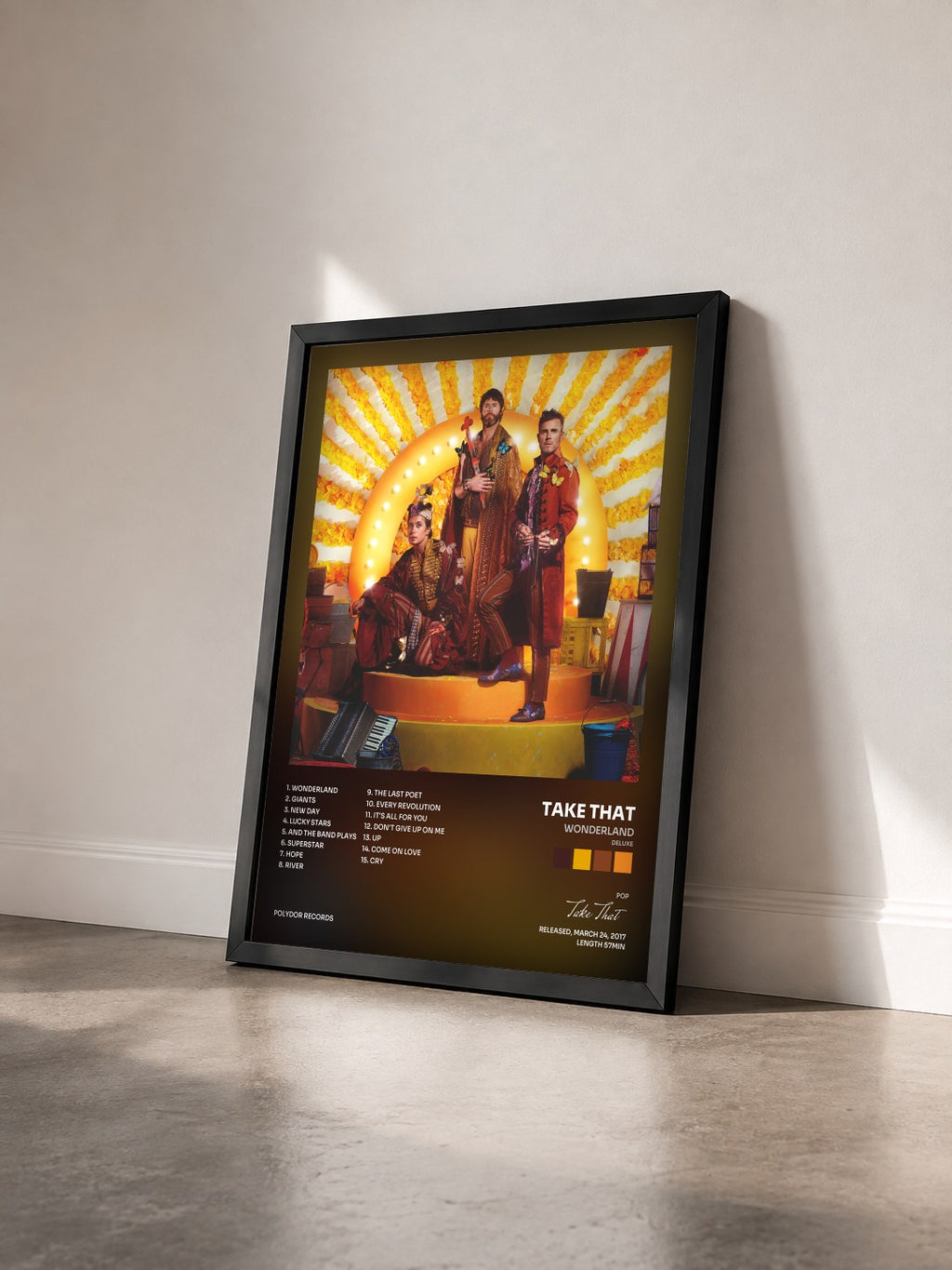 #noir Tableau de l'album Wonderland (Deluxe) de Take That vu de trois quarts, cadre noir