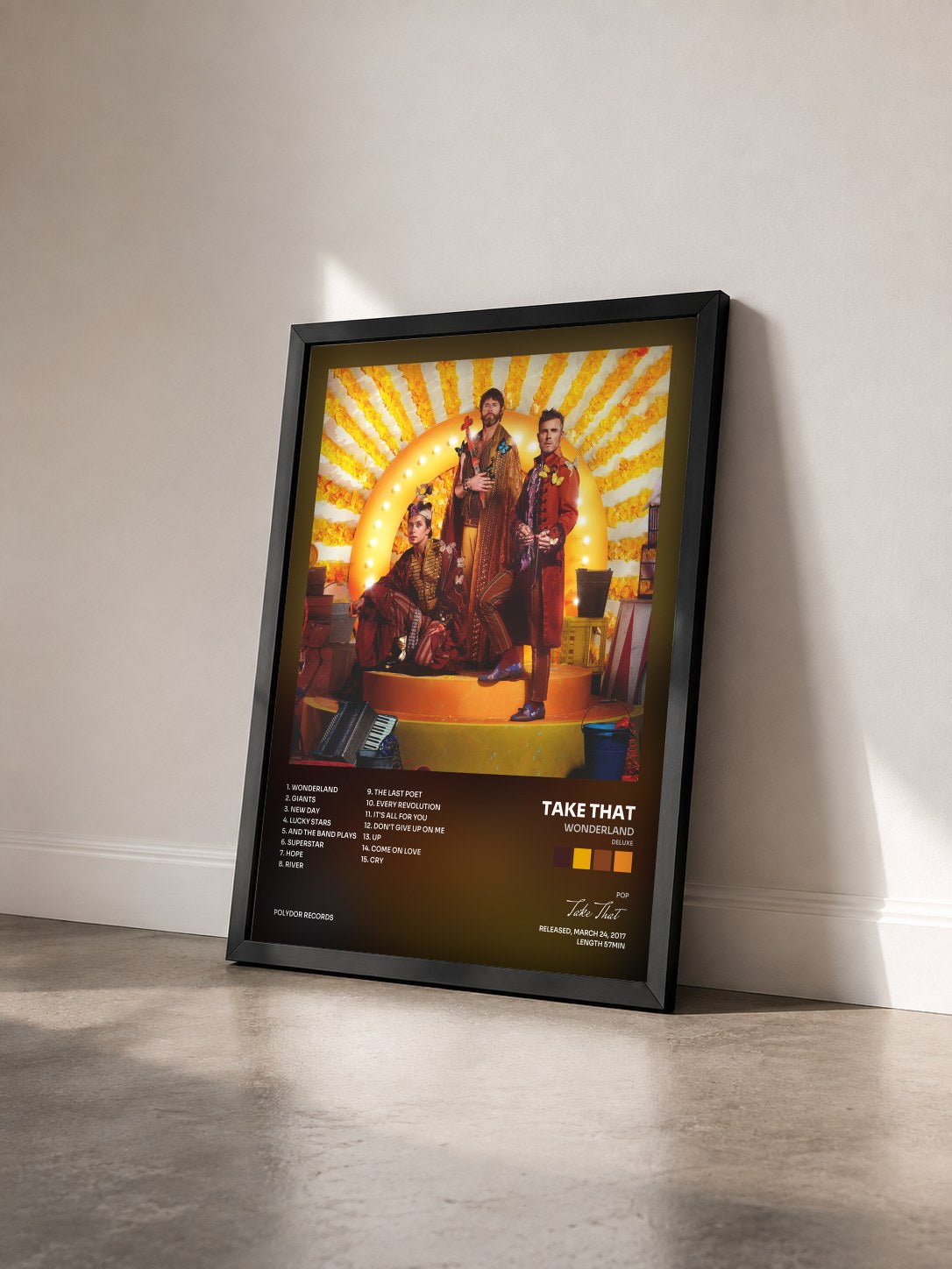#noir Tableau de l'album Wonderland (Deluxe) de Take That vu de trois quarts, cadre noir