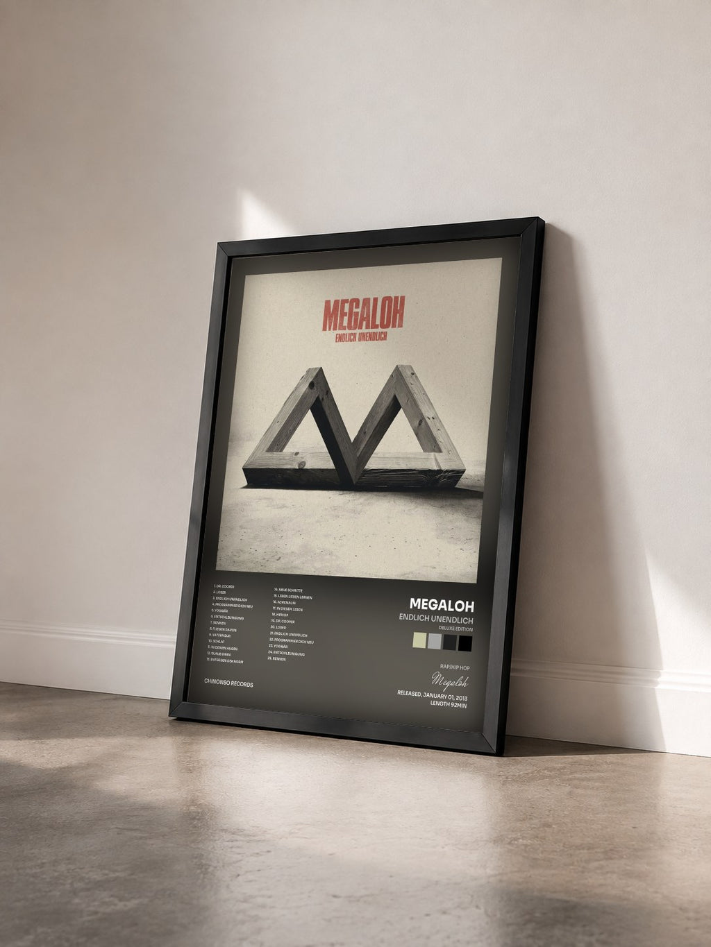 #noir Tableau de l'album Endlich Unendlich (Deluxe Edition) de Megaloh vu de trois quarts, cadre noir