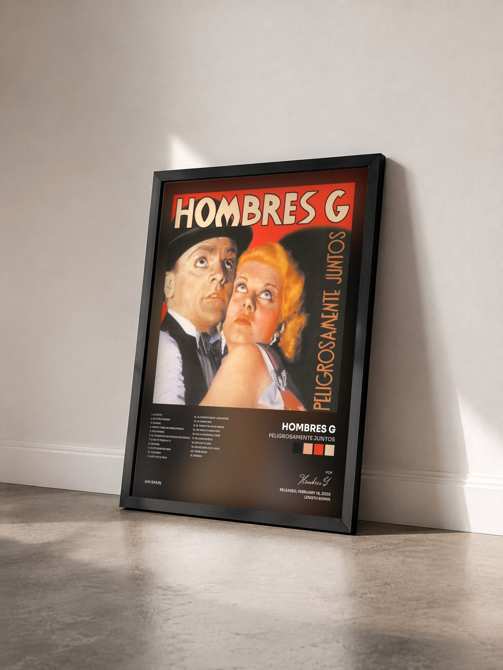 #noir Tableau de l'album Peligrosamente Juntos de Hombres G vu de trois quarts, cadre noir