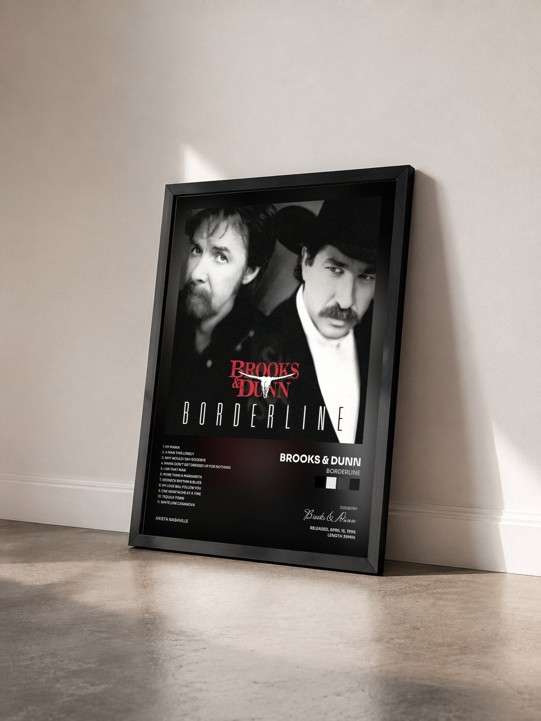 #noir Tableau de l'album Borderline de Brooks & Dunn vu de trois quarts, cadre noir