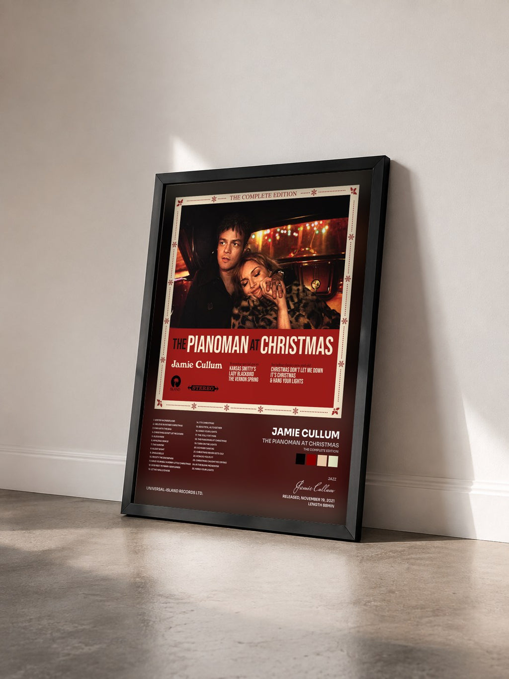 #noir Tableau de l'album The Pianoman at Christmas (The Complete Edition) de Jamie Cullum vu de trois quarts, cadre noir