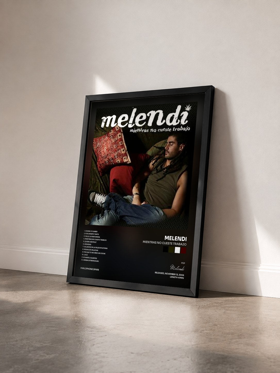 #noir Tableau de l'album Mientras No Cueste Trabajo de Melendi vu de trois quarts, cadre noir