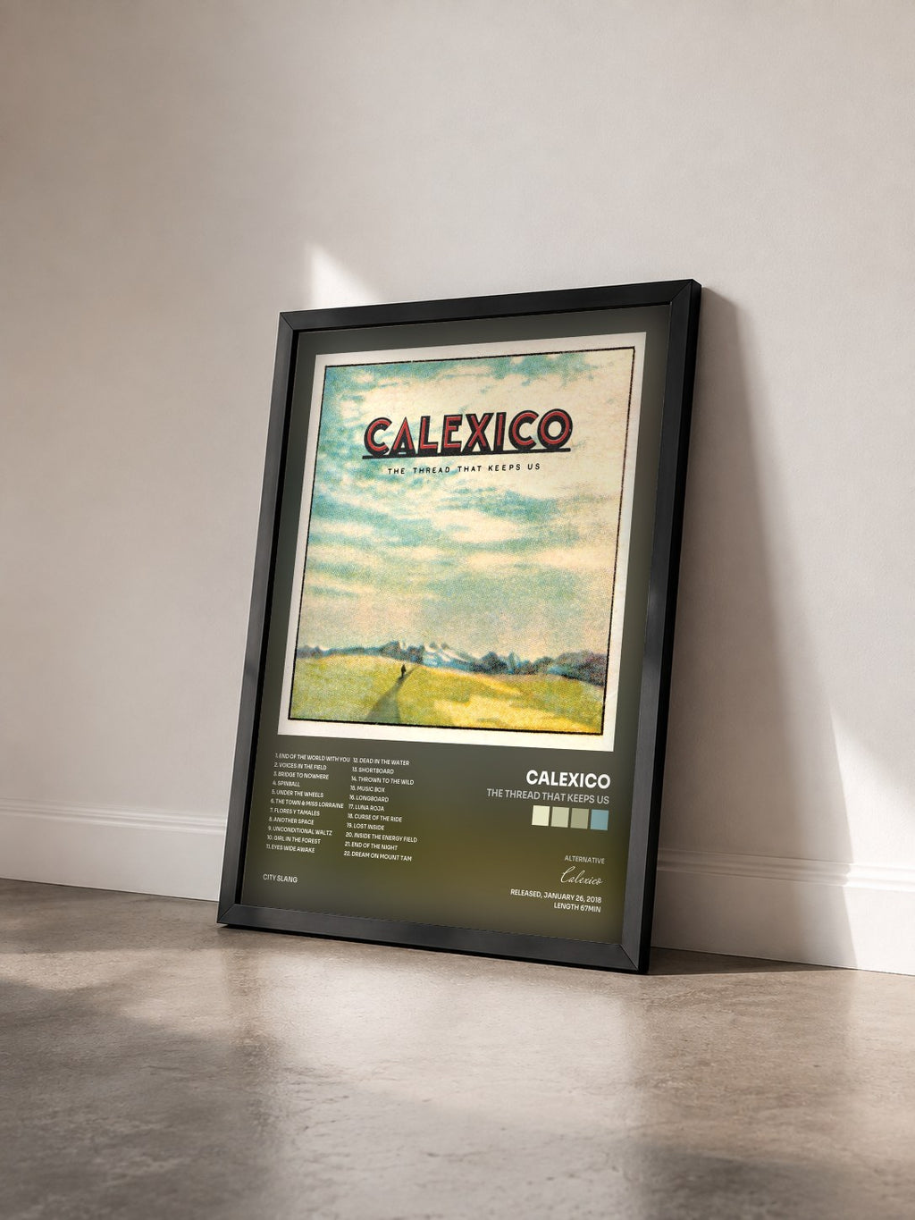 #noir Tableau de l'album The Thread That Keeps Us de Calexico vu de trois quarts, cadre noir