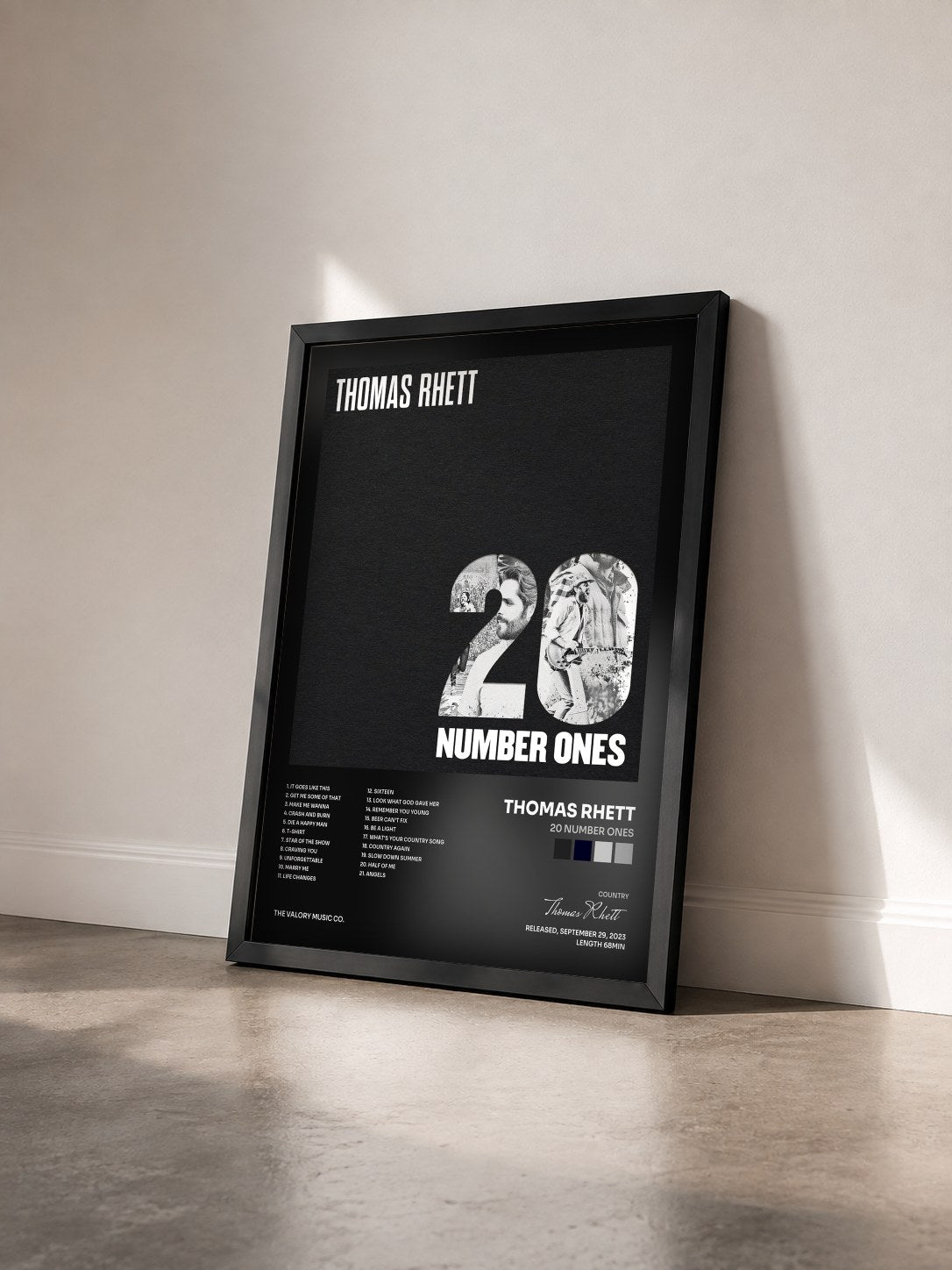 #noir Tableau de l'album 20 Number Ones de Thomas Rhett vu de trois quarts, cadre noir