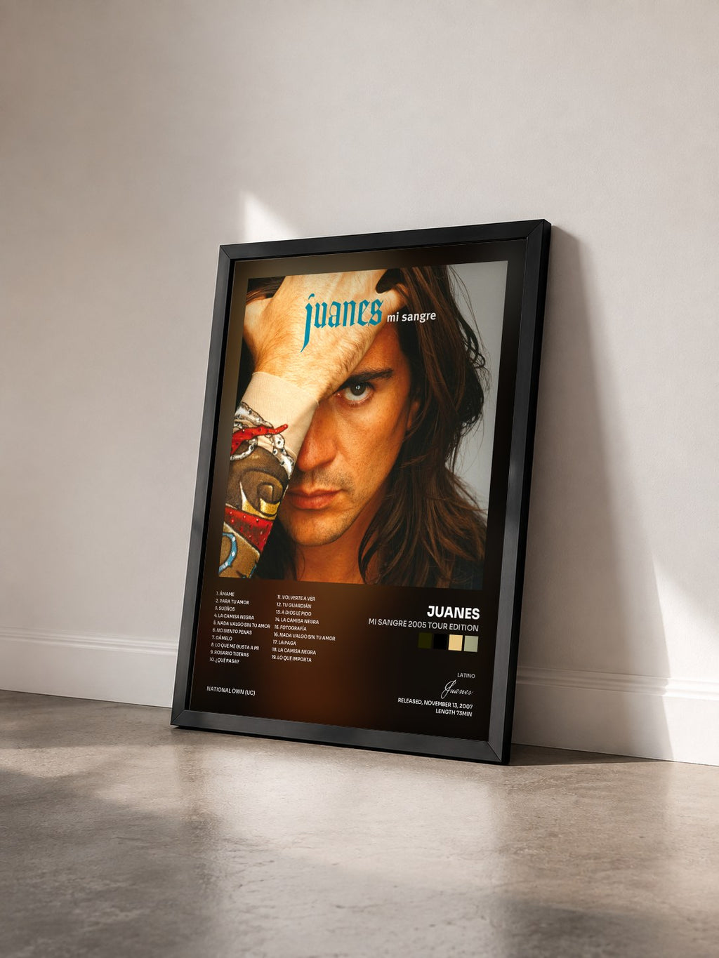 #noir Tableau de l'album Mi Sangre 2005 Tour Edition de Juanes vu de trois quarts, cadre noir