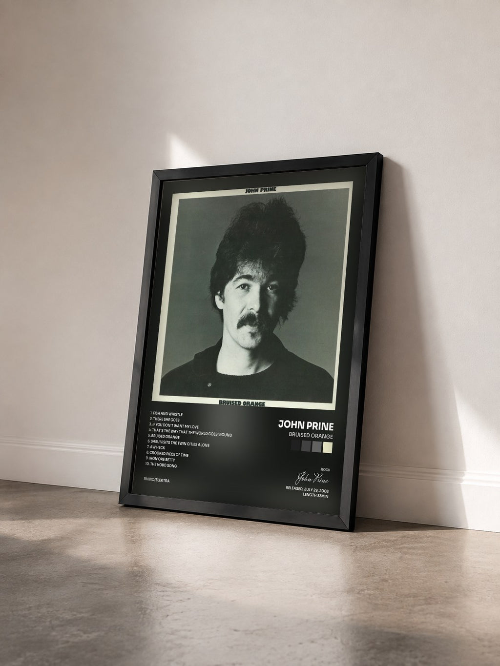 #noir Tableau de l'album Bruised Orange de John Prine vu de trois quarts, cadre noir