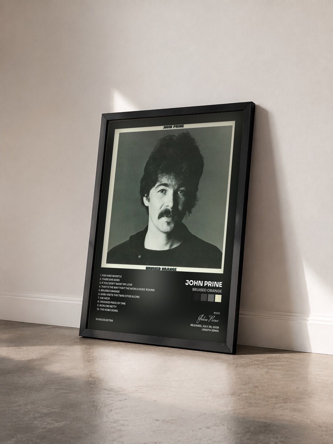 #noir Tableau de l'album Bruised Orange de John Prine vu de trois quarts, cadre noir