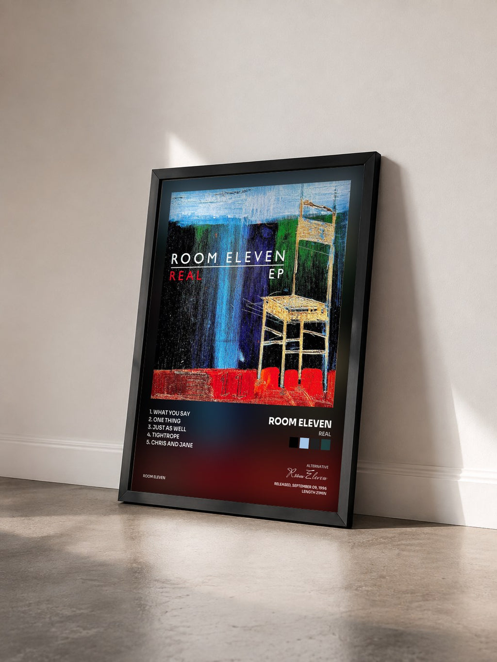 #noir Tableau de l'album Real de Room Eleven vu de trois quarts, cadre noir