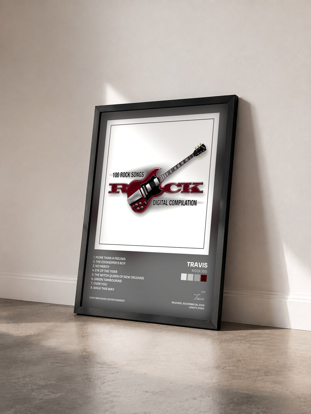 #noir Tableau de l'album Rock 100 de Travis vu de trois quarts, cadre noir