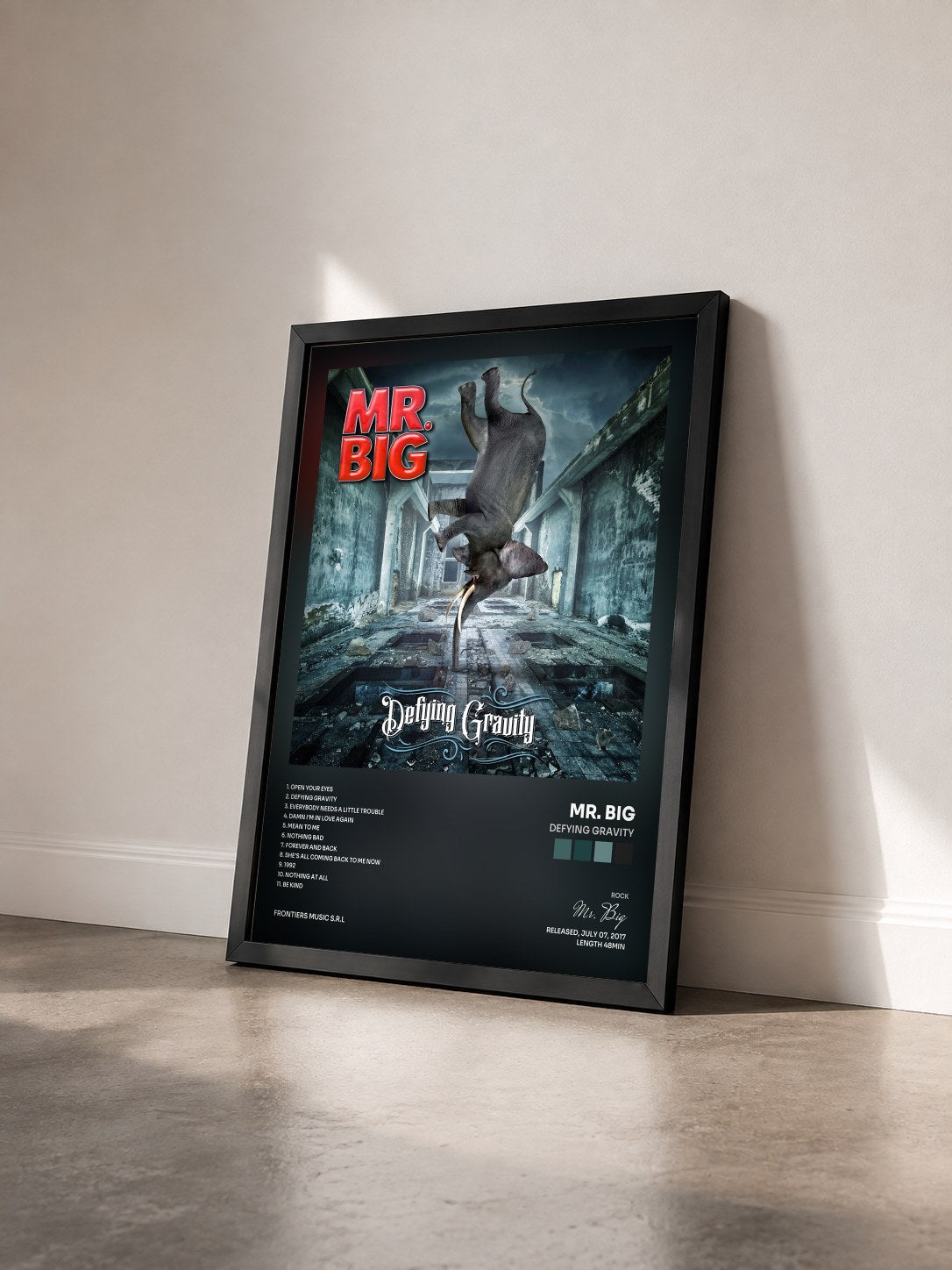 #noir Tableau de l'album Defying Gravity de Mr. Big vu de trois quarts, cadre noir