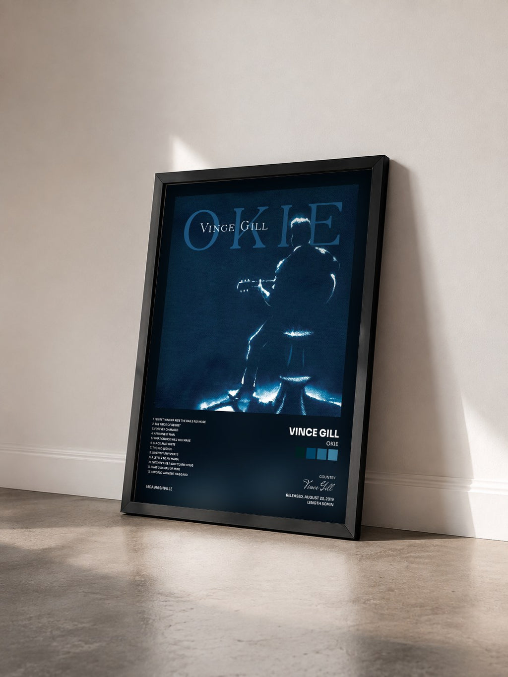#noir Tableau de l'album Okie de Vince Gill vu de trois quarts, cadre noir