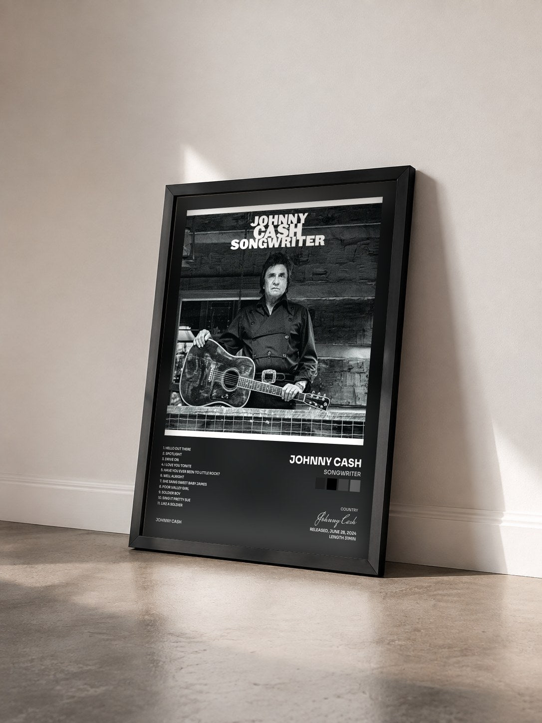 #noir Tableau de l'album Songwriter de Johnny Cash vu de trois quarts, cadre noir