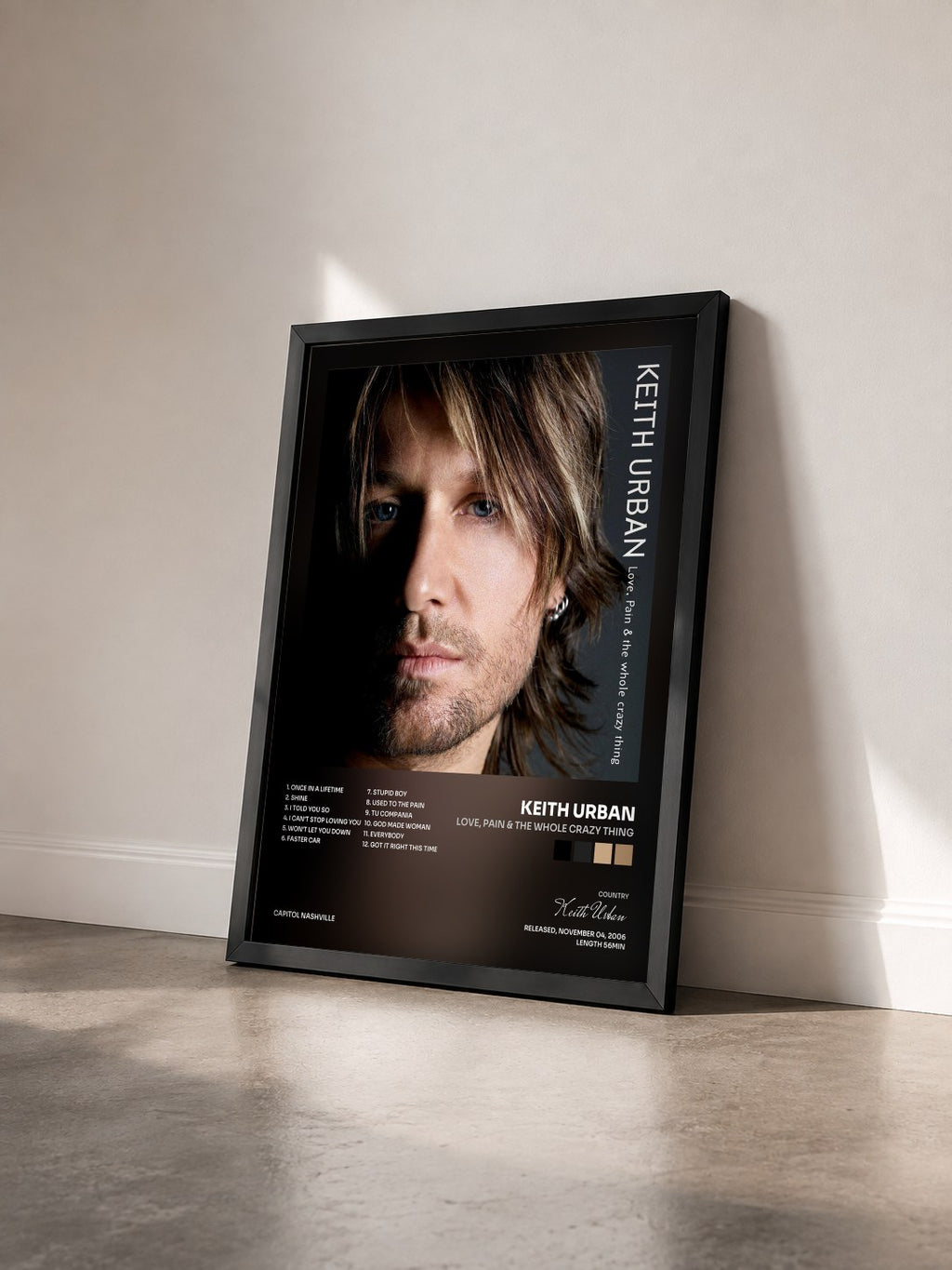 #noir Tableau de l'album Love, Pain & The Whole Crazy Thing de Keith Urban vu de trois quarts, cadre noir