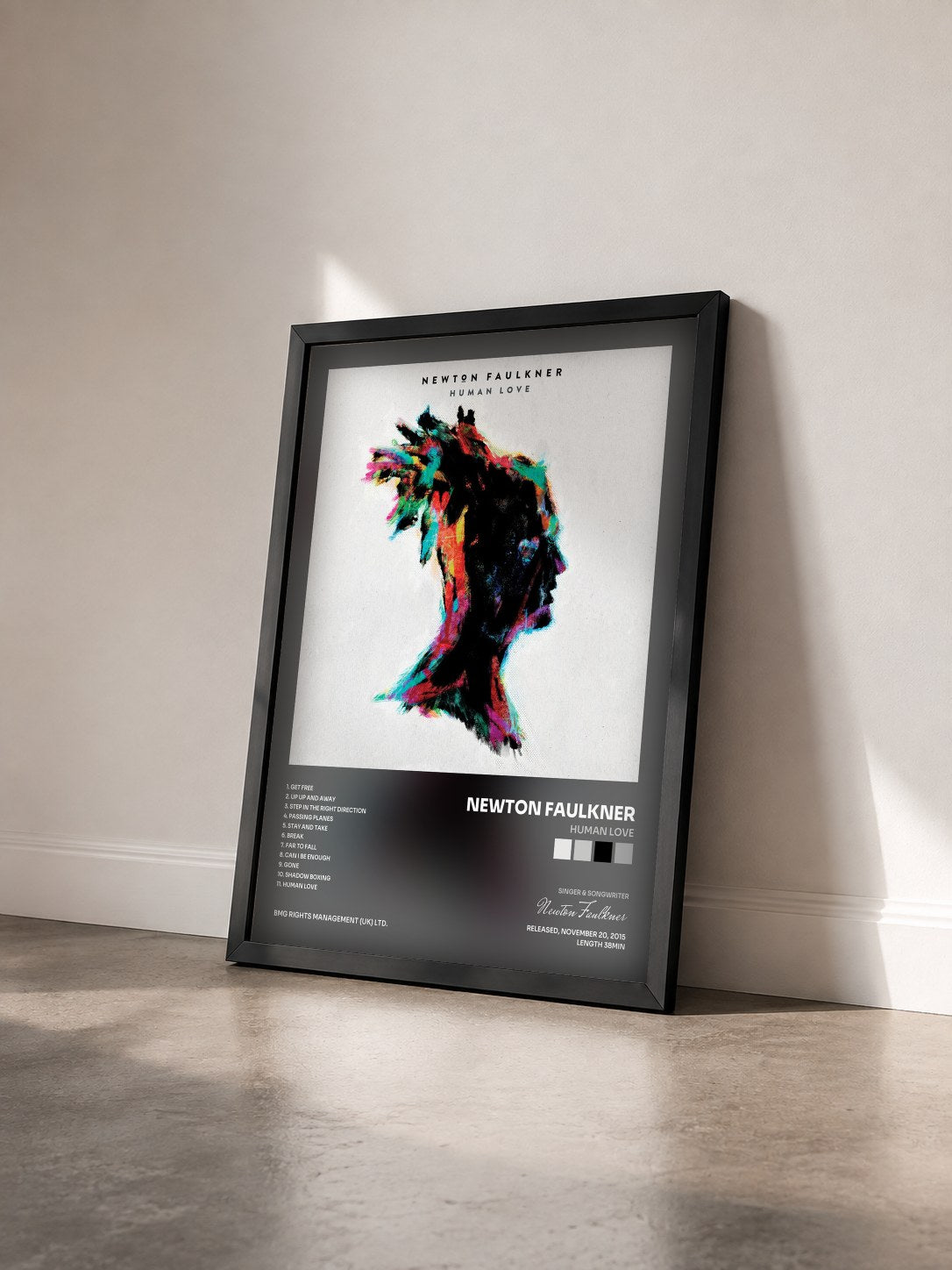 #noir Tableau de l'album Human Love de Newton Faulkner vu de trois quarts, cadre noir