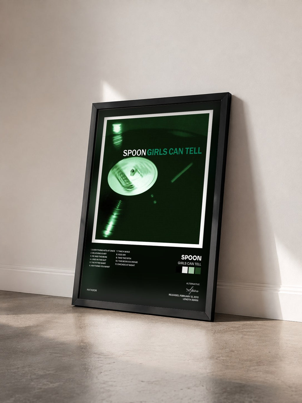 #noir Tableau de l'album Girls Can Tell de Spoon vu de trois quarts, cadre noir