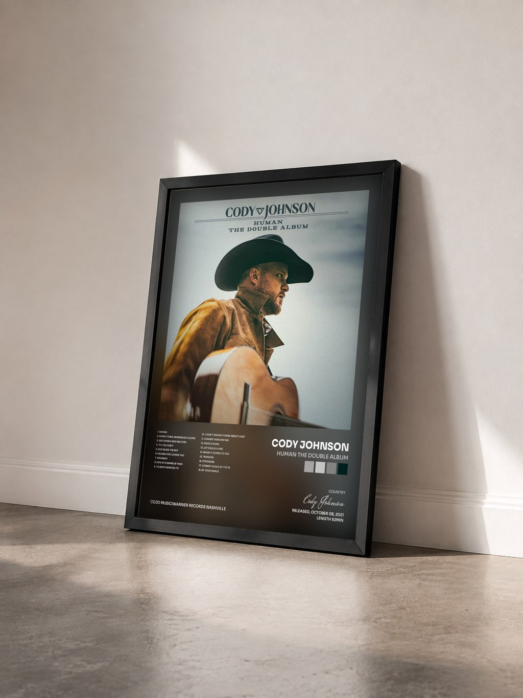 #noir Tableau de l'album Human The Double Album de Cody Johnson vu de trois quarts, cadre noir