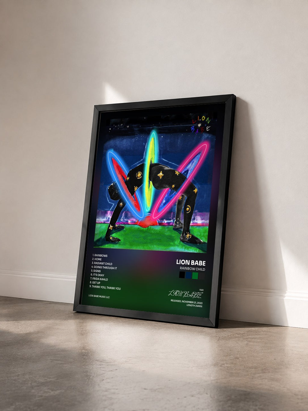 #noir Tableau de l'album Rainbow Child de LION BABE vu de trois quarts, cadre noir