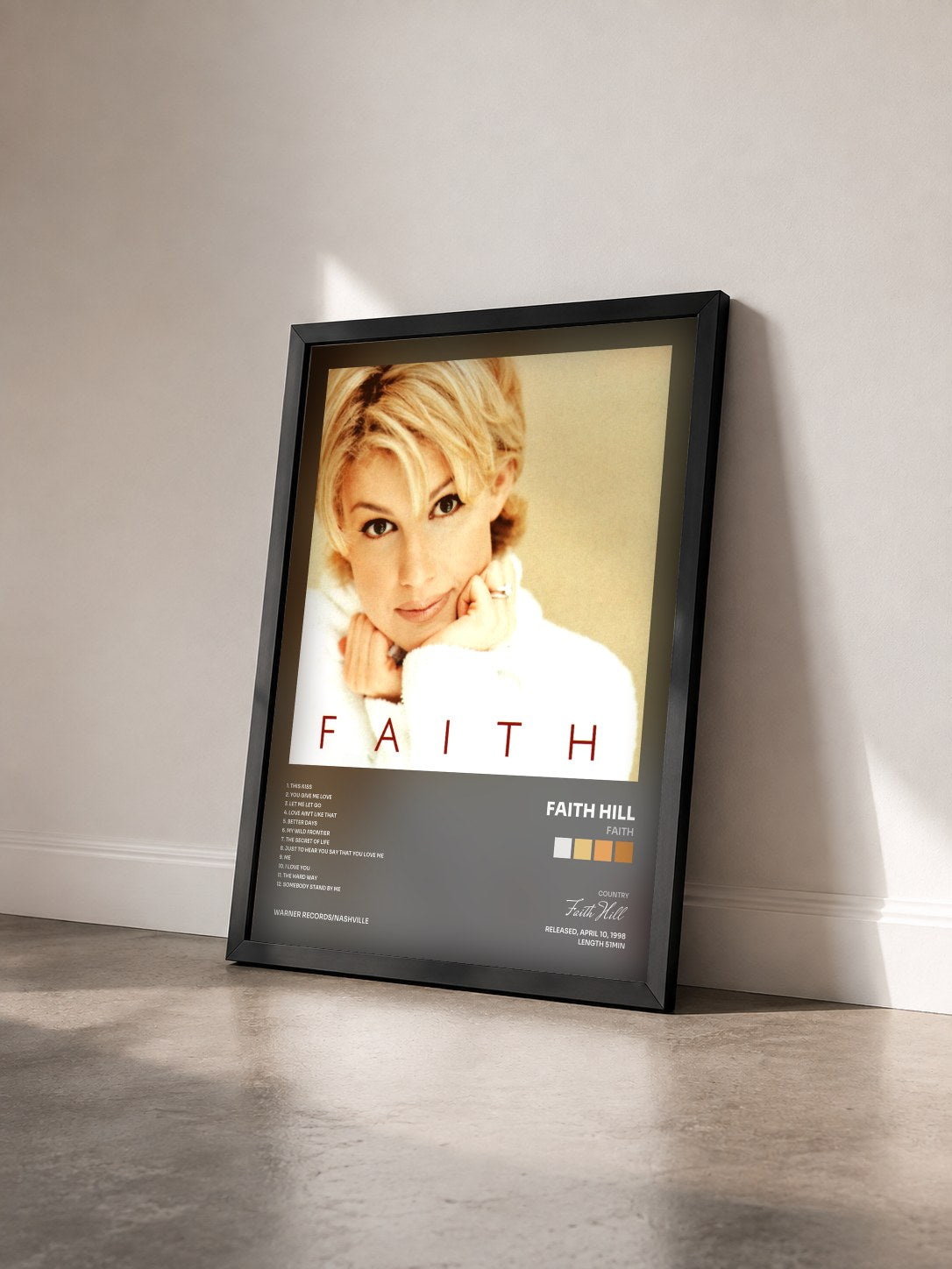 #noir Tableau de l'album Faith de Faith Hill vu de trois quarts, cadre noir