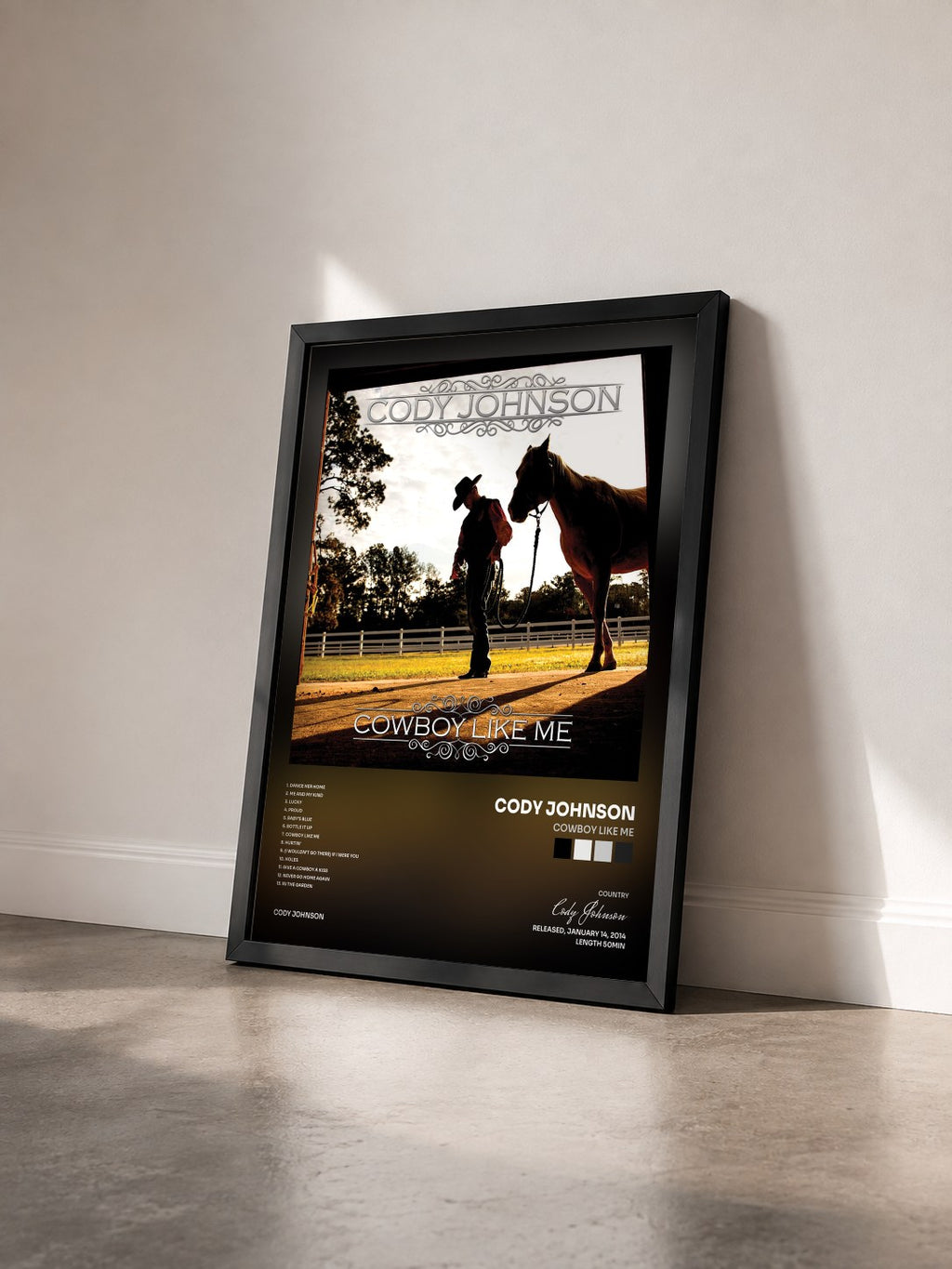 #noir Tableau de l'album Cowboy Like Me de Cody Johnson vu de trois quarts, cadre noir