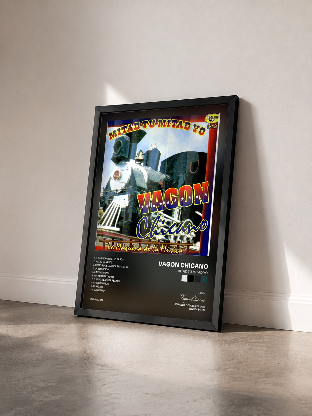 #noir Tableau de l'album Mitad Tu Mitad Yo de Vagon Chicano vu de trois quarts, cadre noir