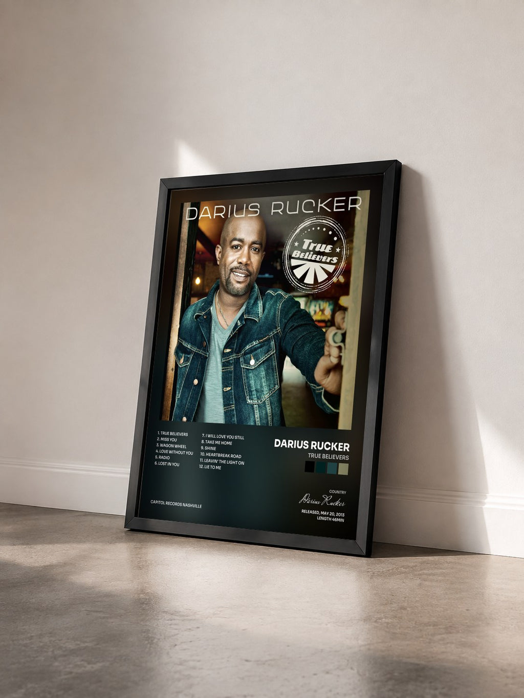 #noir Tableau de l'album True Believers de Darius Rucker vu de trois quarts, cadre noir