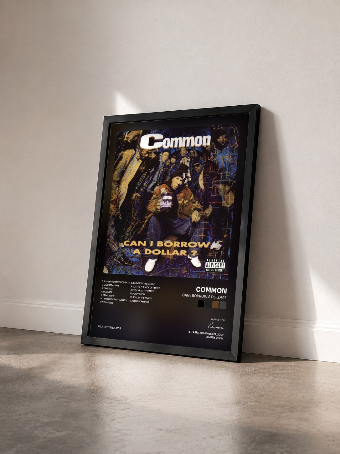 #noir Tableau de l'album Can I Borrow A Dollar? de Common vu de trois quarts, cadre noir