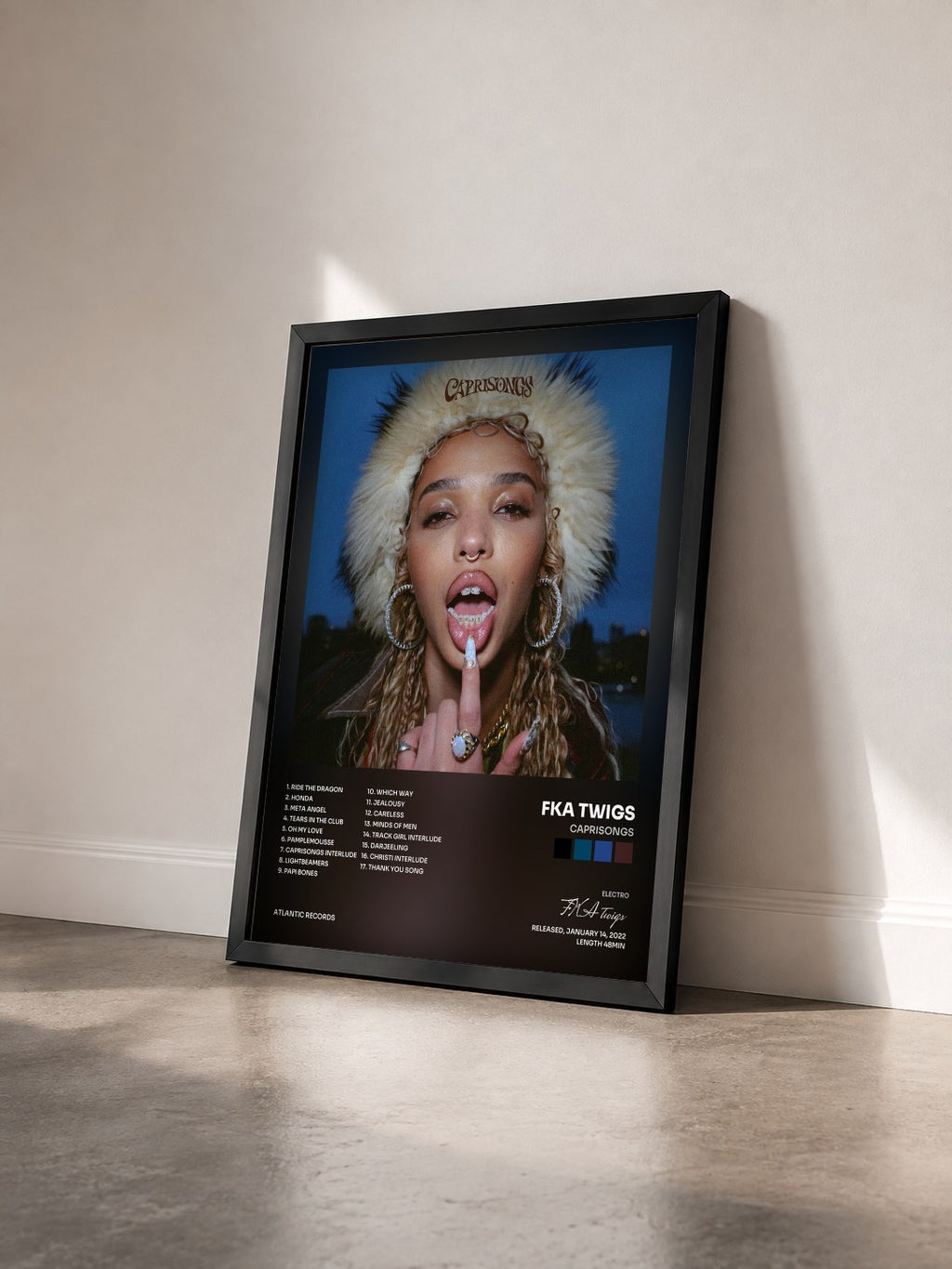 #noir Tableau de l'album CAPRISONGS de FKA twigs vu de trois quarts, cadre noir