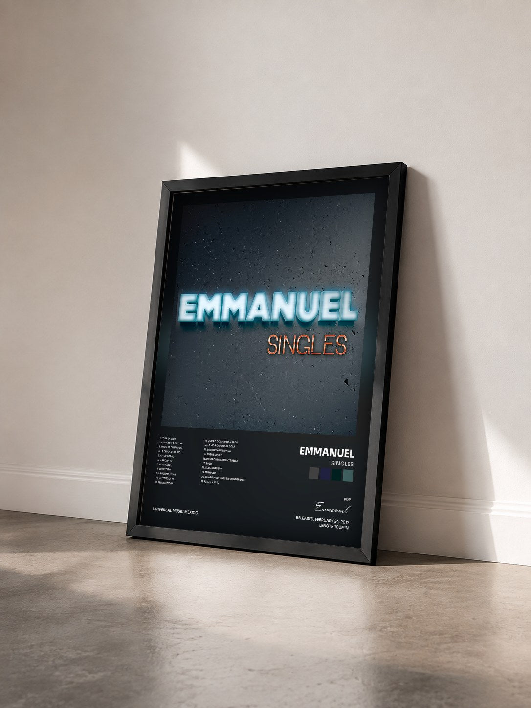 #noir Tableau de l'album Singles de Emmanuel vu de trois quarts, cadre noir