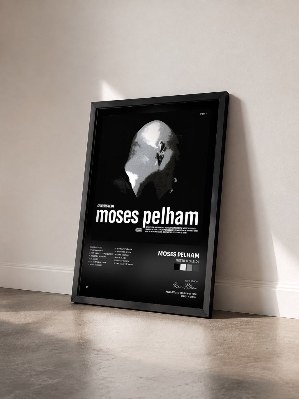 #noir Tableau de l'album Geteiltes Leid I de Moses Pelham vu de trois quarts, cadre noir