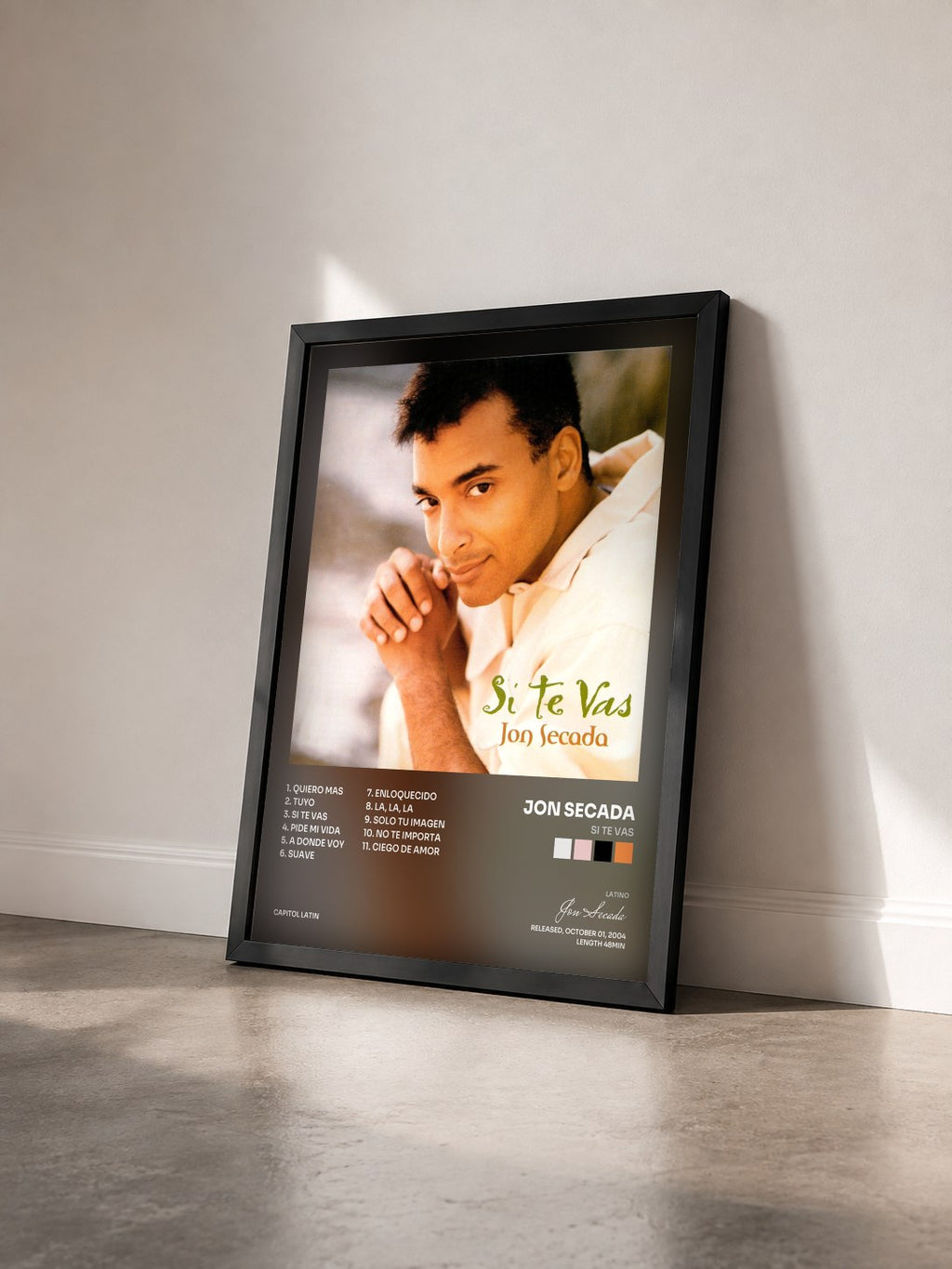 #noir Tableau de l'album Si Te Vas de Jon Secada vu de trois quarts, cadre noir