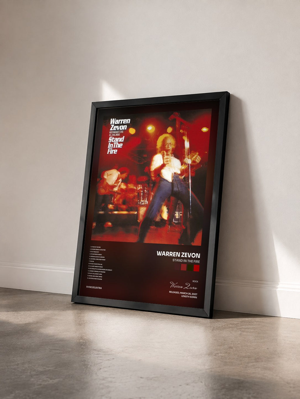 #noir Tableau de l'album Stand in the Fire de Warren Zevon vu de trois quarts, cadre noir