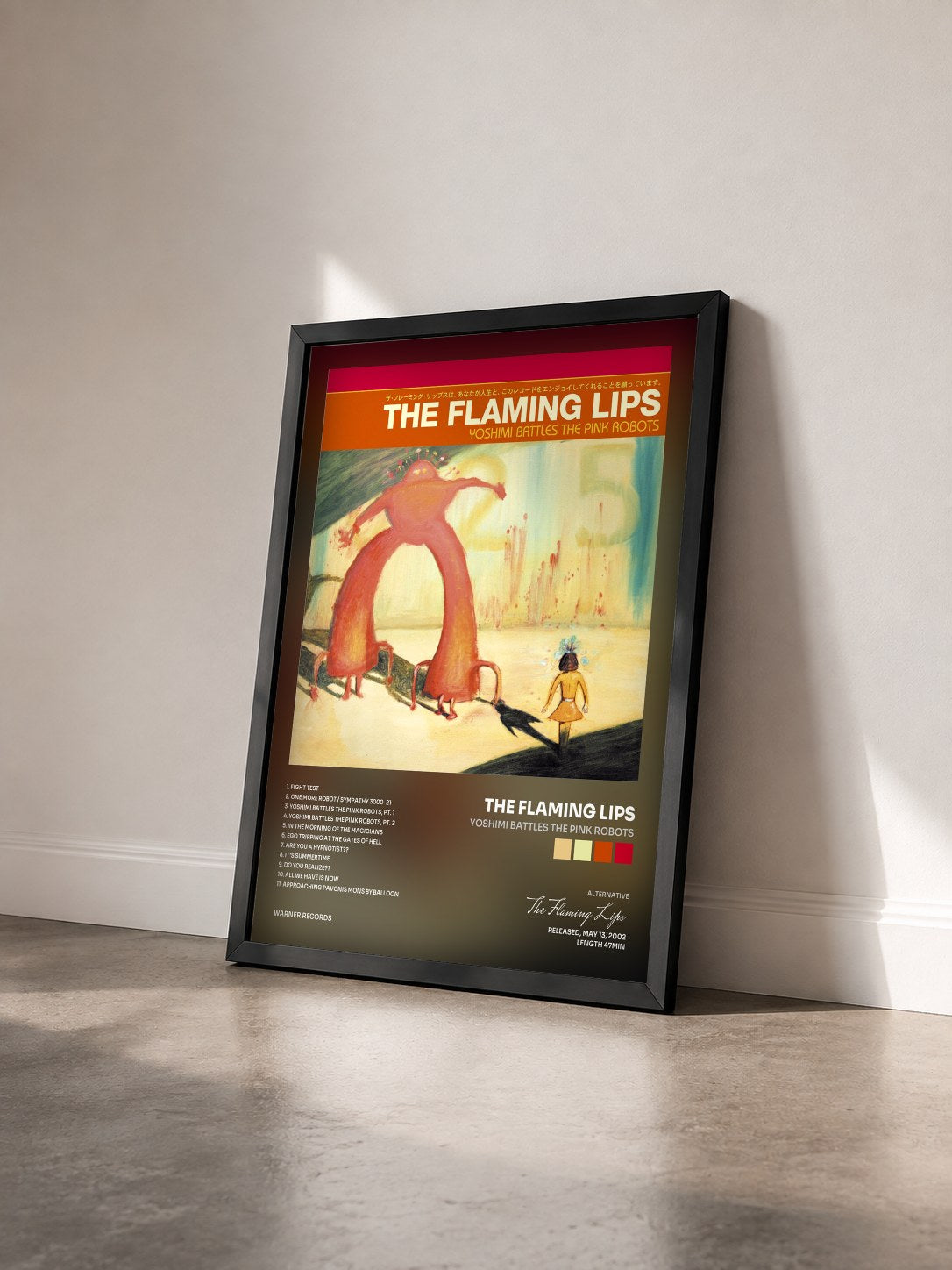 #noir Tableau de l'album Yoshimi Battles the Pink Robots de The Flaming Lips vu de trois quarts, cadre noir