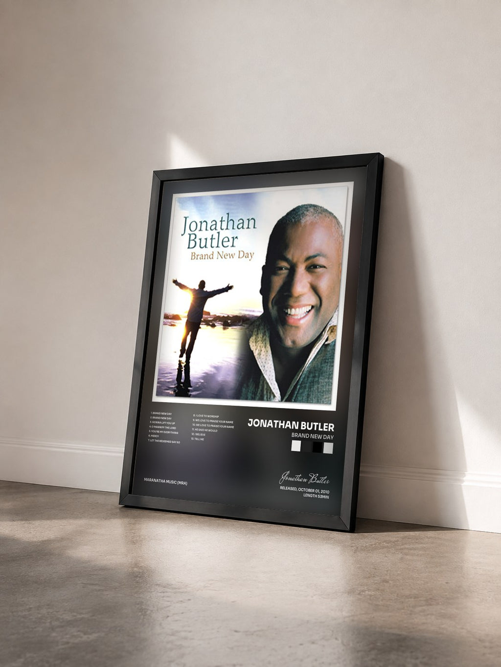 #noir Tableau de l'album Brand New Day de Jonathan Butler vu de trois quarts, cadre noir