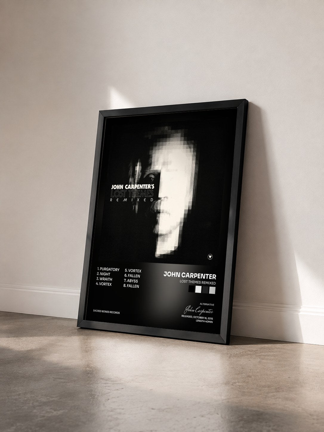 #noir Tableau de l'album Lost Themes Remixed de John Carpenter vu de trois quarts, cadre noir