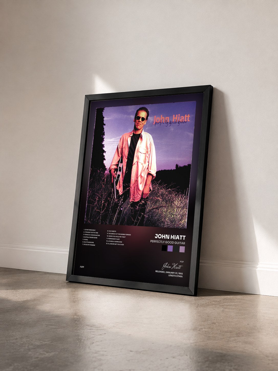 #noir Tableau de l'album Perfectly Good Guitar de John Hiatt vu de trois quarts, cadre noir