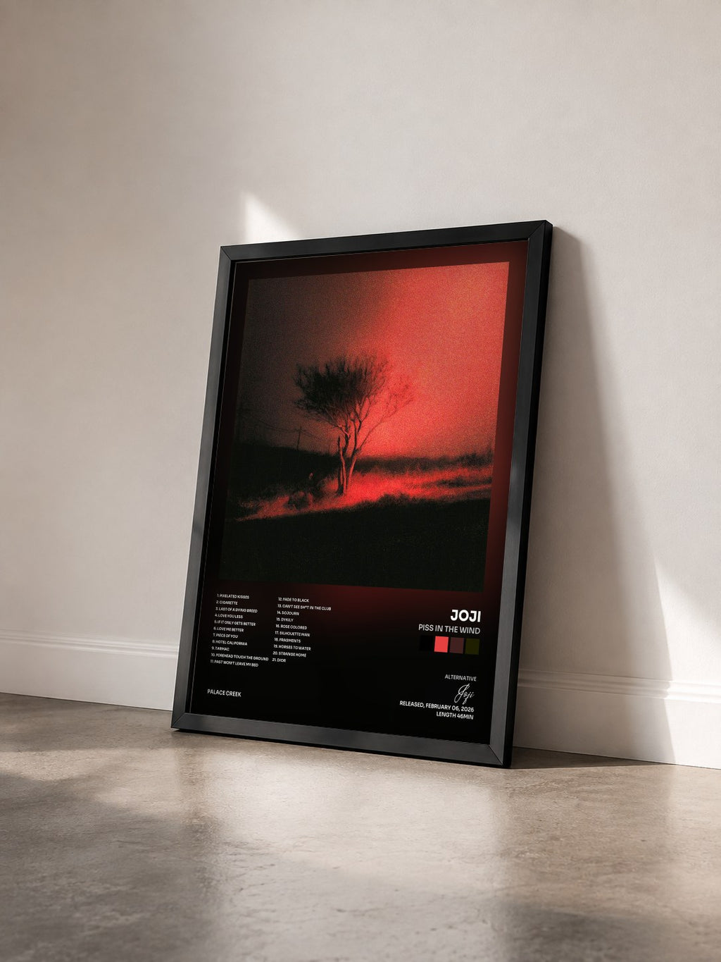 #noir Tableau de l'album Piss In The Wind de Joji vu de trois quarts, cadre noir
