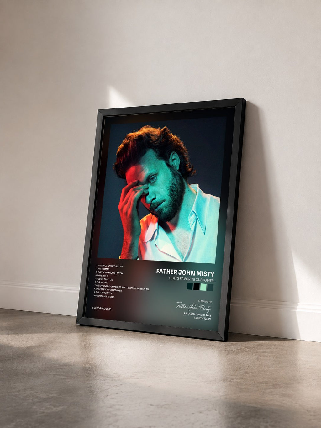 #noir Tableau de l'album God's Favorite Customer de Father John Misty vu de trois quarts, cadre noir