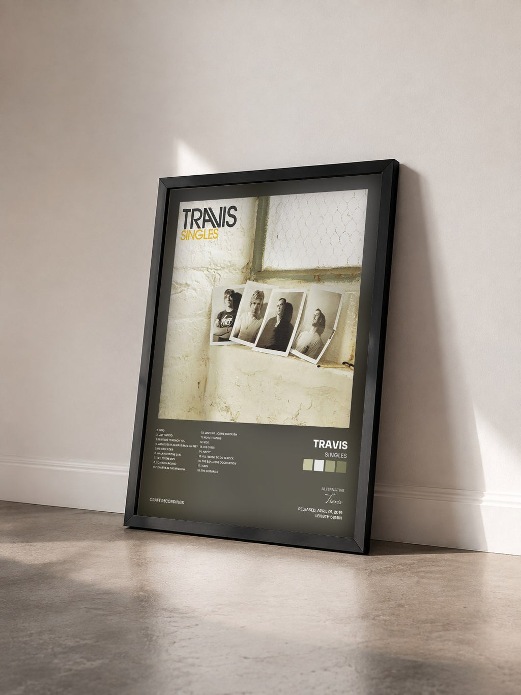 #noir Tableau de l'album Singles de Travis vu de trois quarts, cadre noir