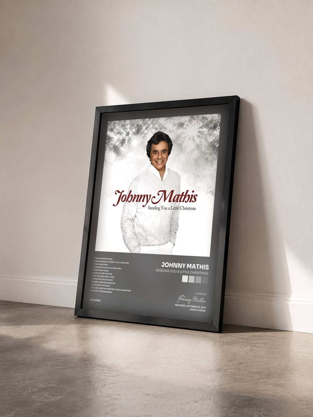 #noir Tableau de l'album Sending You a Little Christmas de Johnny Mathis vu de trois quarts, cadre noir