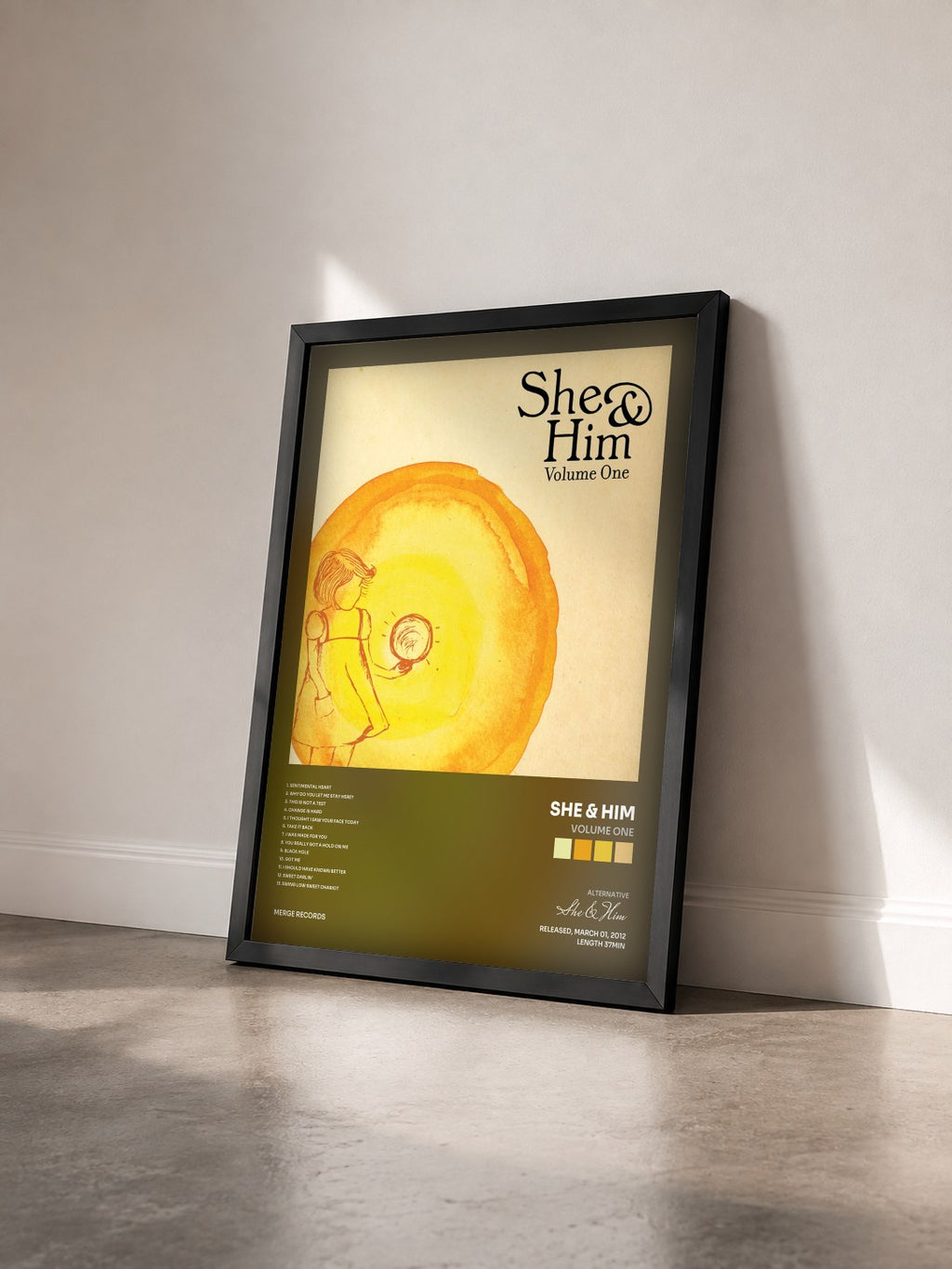 #noir Tableau de l'album Volume One de She & Him vu de trois quarts, cadre noir