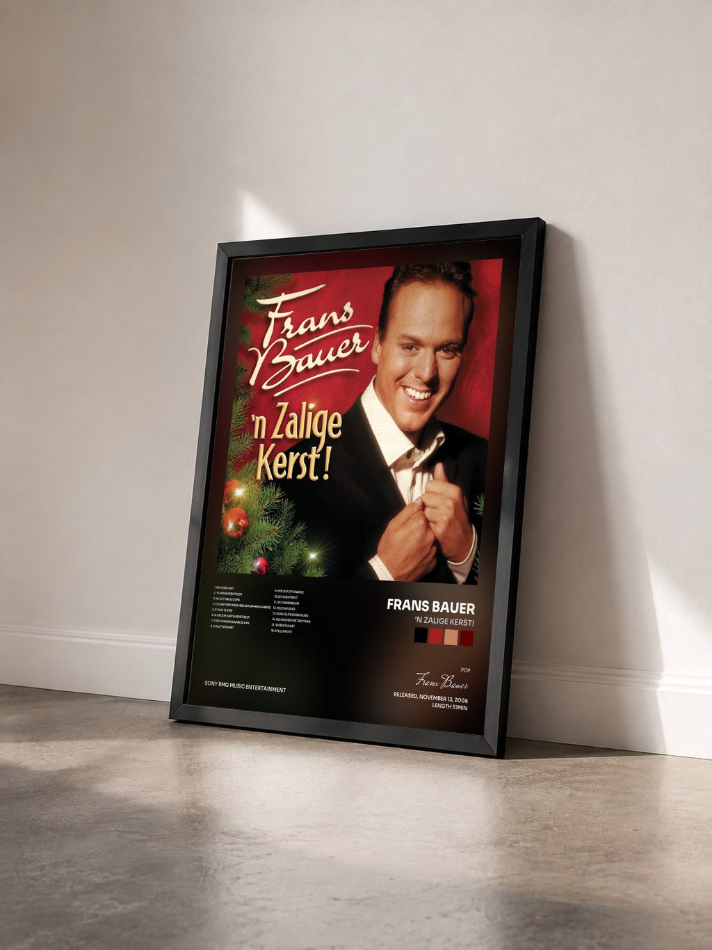 #noir Tableau de l'album 'n Zalige Kerst! de Frans Bauer vu de trois quarts, cadre noir