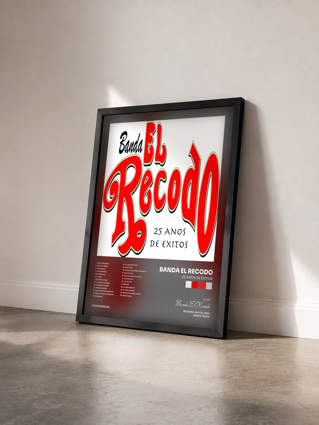#noir Tableau de l'album 25 Años De Éxitos de Banda El Recodo vu de trois quarts, cadre noir