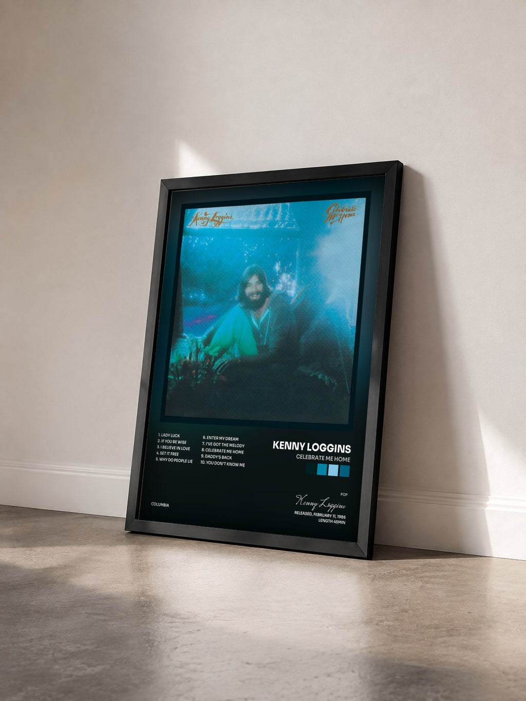 #noir Tableau de l'album Celebrate Me Home de Kenny Loggins vu de trois quarts, cadre noir