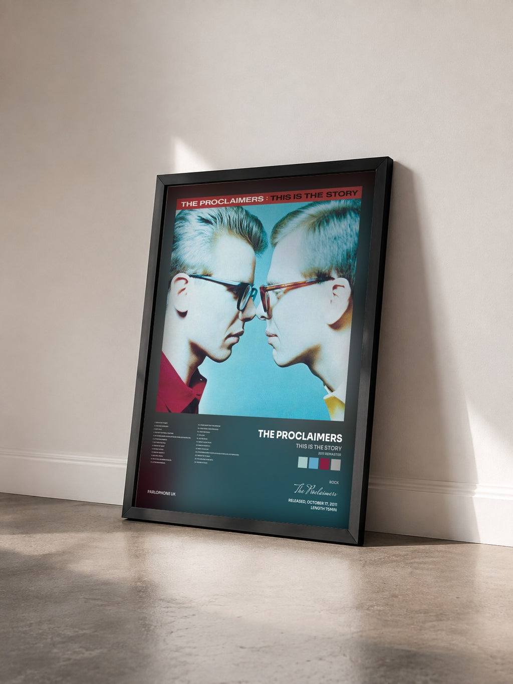 #noir Tableau de l'album This Is the Story (2011 Remaster) de The Proclaimers vu de trois quarts, cadre noir