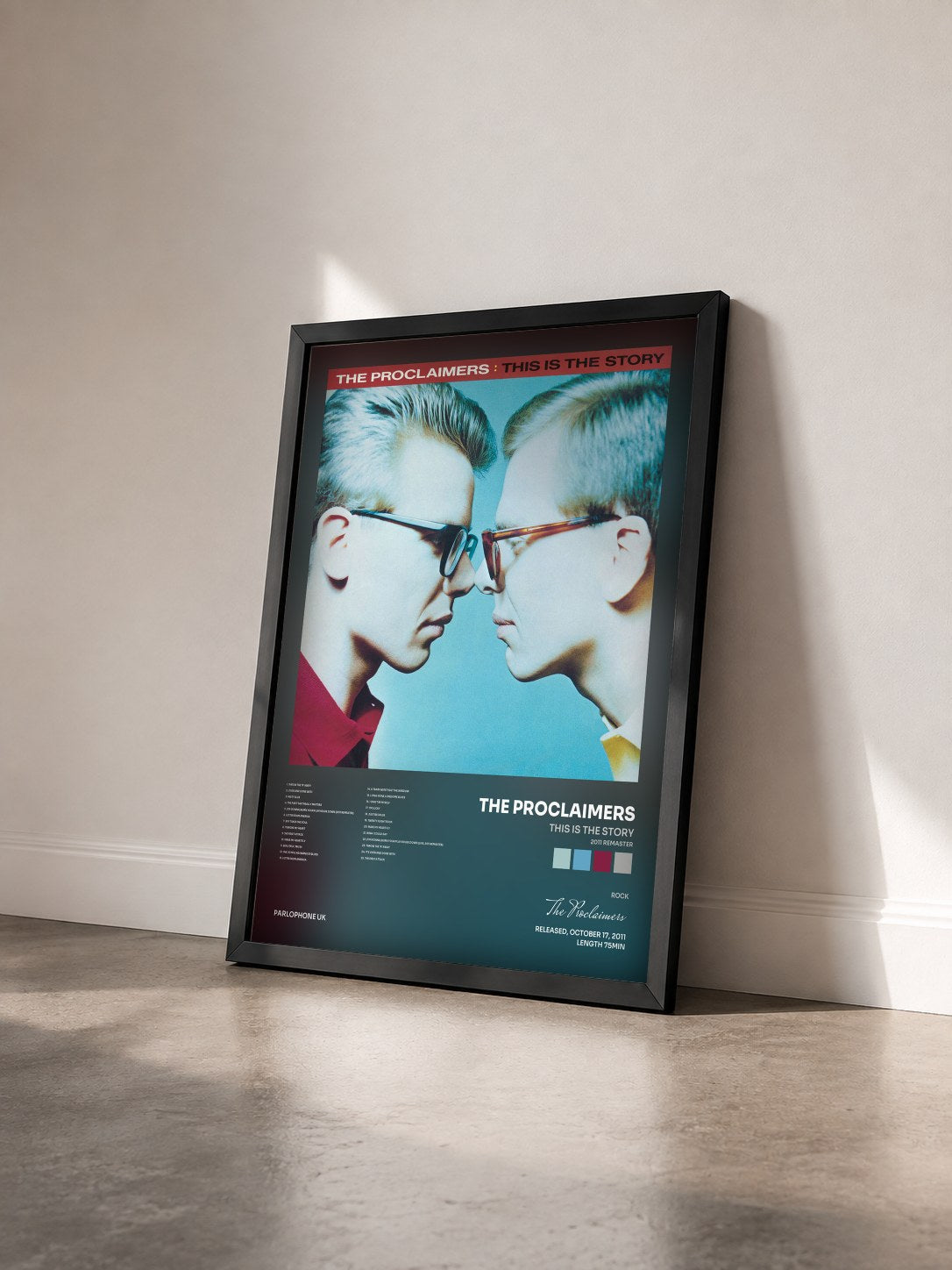 #noir Tableau de l'album This Is the Story (2011 Remaster) de The Proclaimers vu de trois quarts, cadre noir