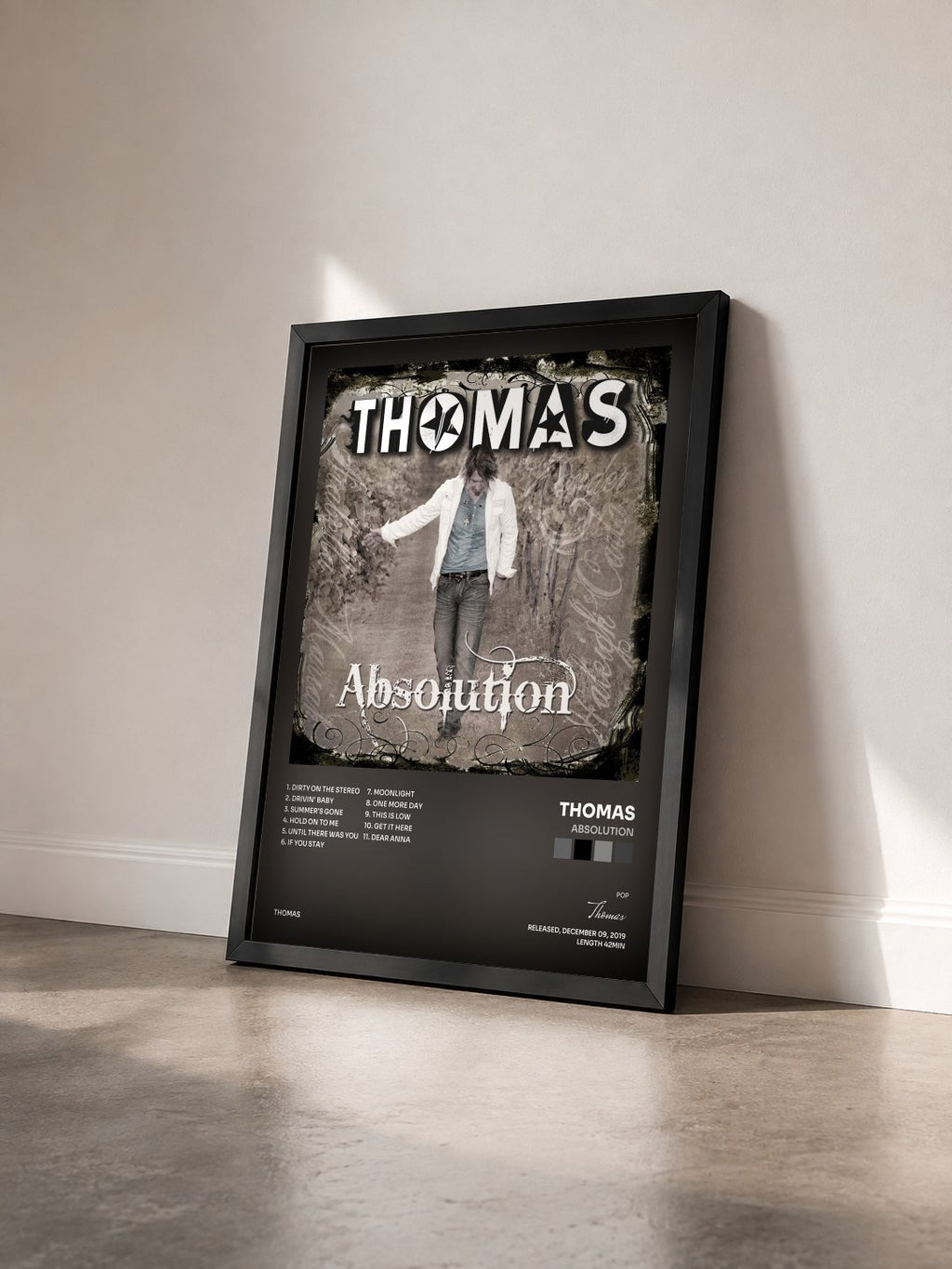 #noir Tableau de l'album Absolution de Thomas vu de trois quarts, cadre noir